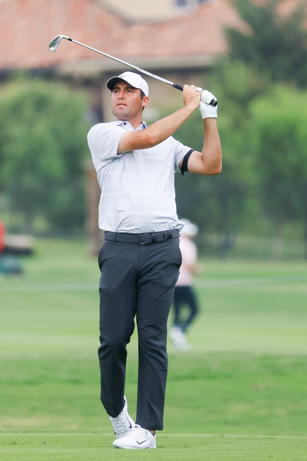 Scottie Scheffler hits on the green of the ninth hole during the second round of the AT&T...