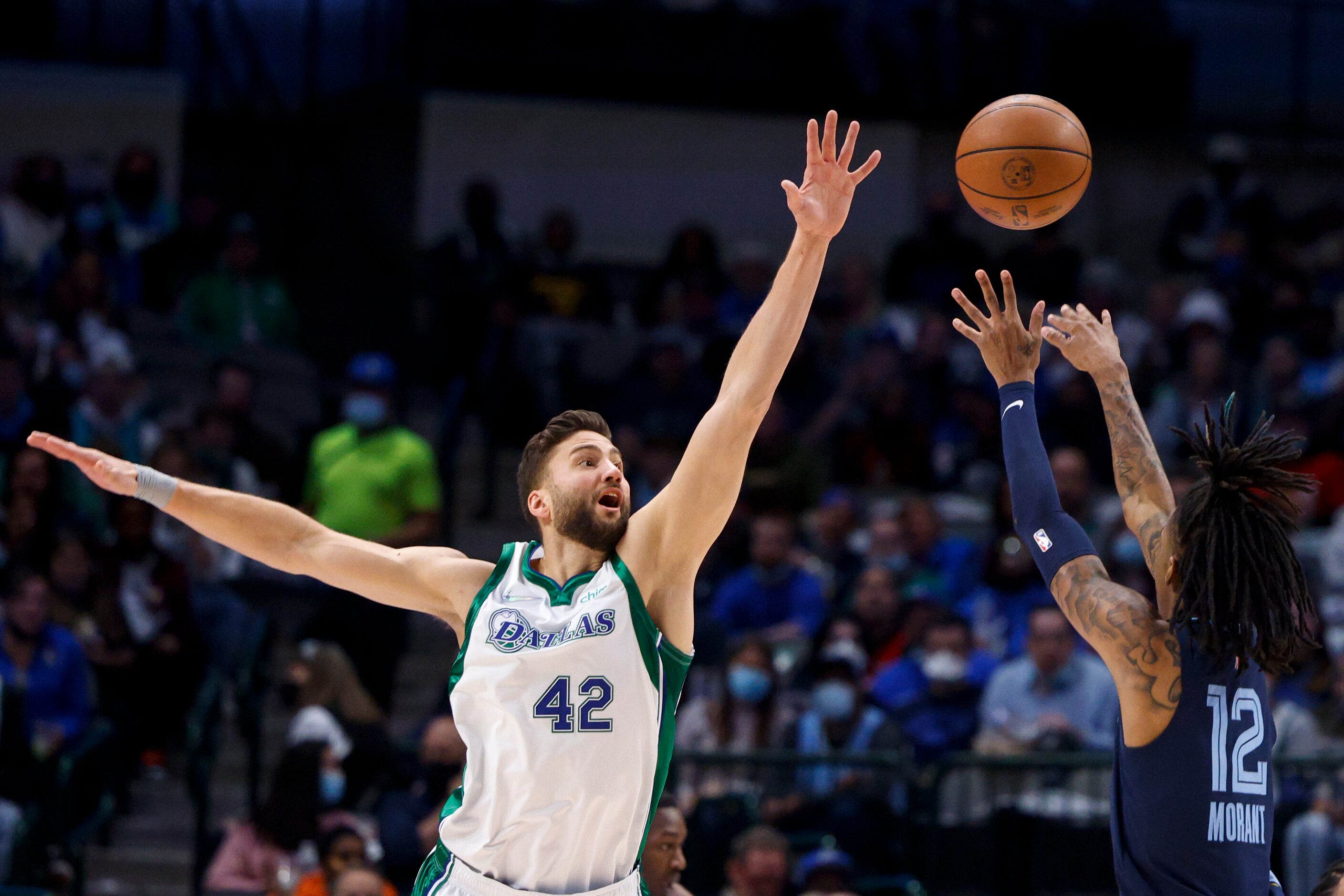 Dallas Mavericks forward Maxi Kleber (42) defends against Memphis Grizzlies guard Ja Morant...