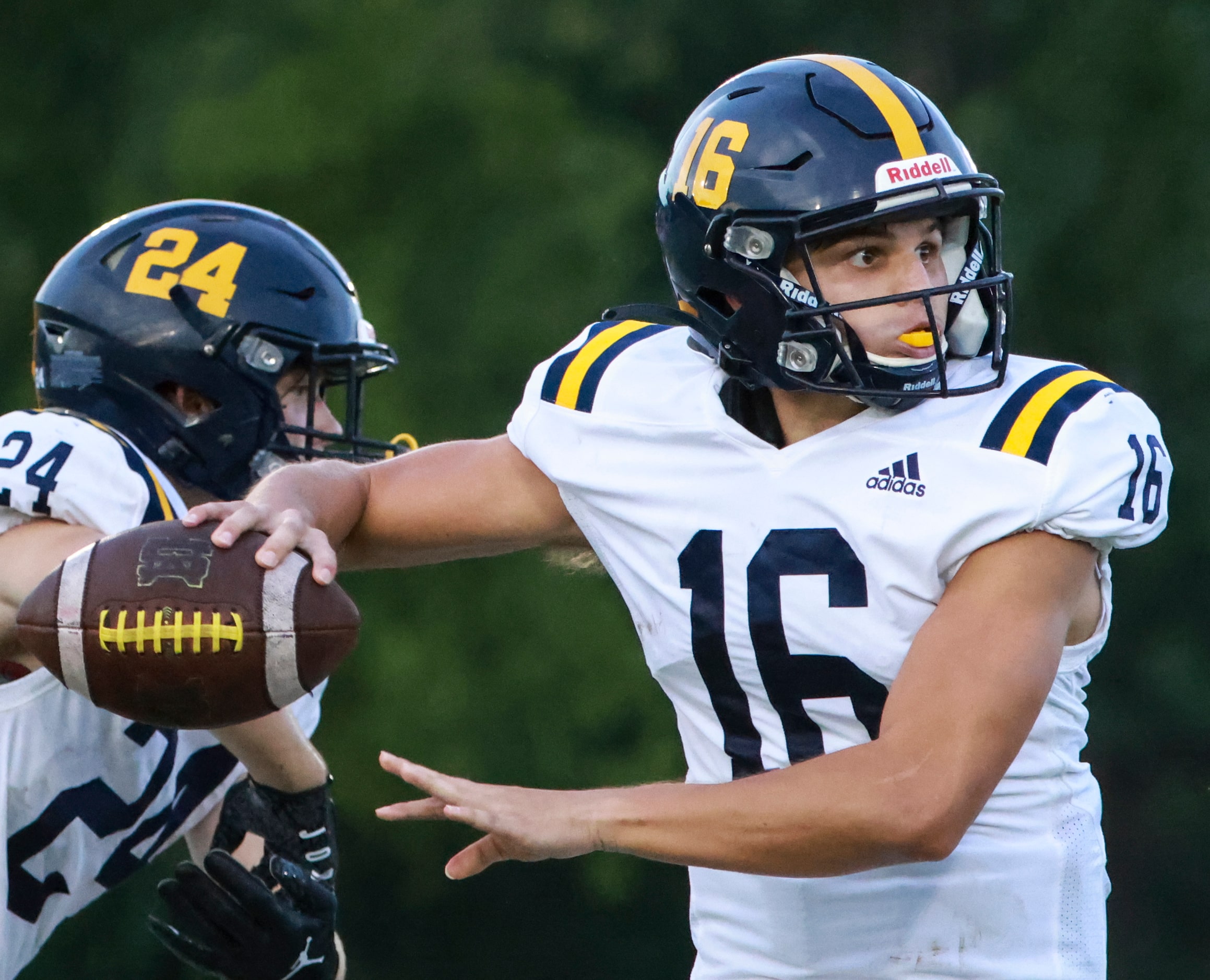 St. Mark's School of Texas Asher Wilburn (16) winds up to throw the ball during the football...