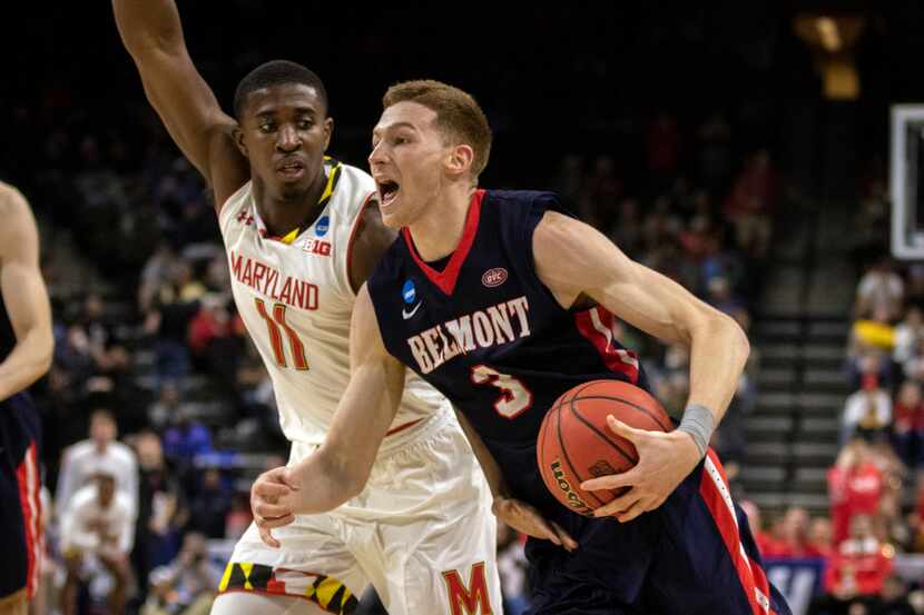 Belmont guard Dylan Windler (3) drives to the basket while being defended by Maryland guard...