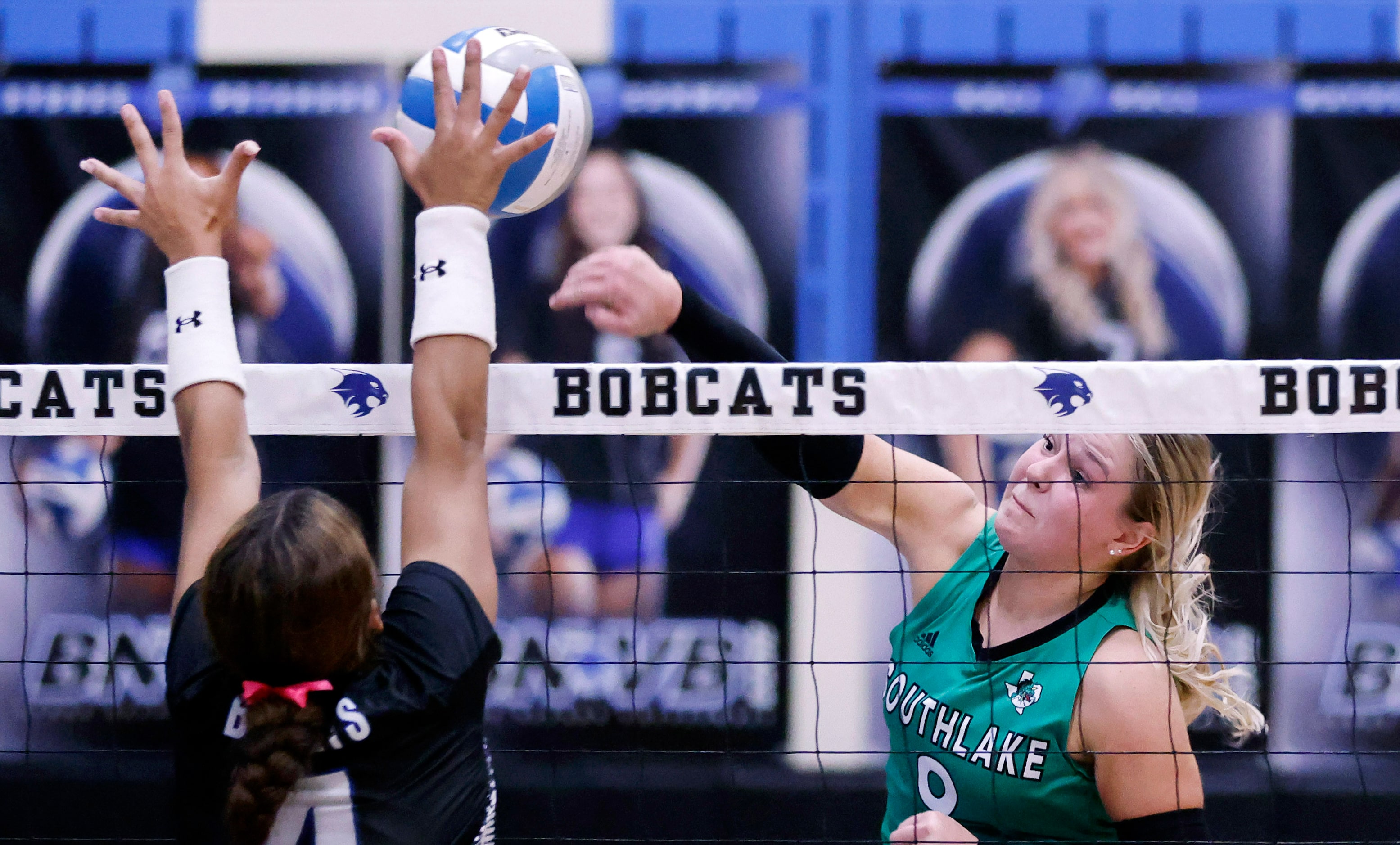 Southlake Carroll outside hitter Taryn Barnes (9) spikes the ball past at Trophy Club Byron...