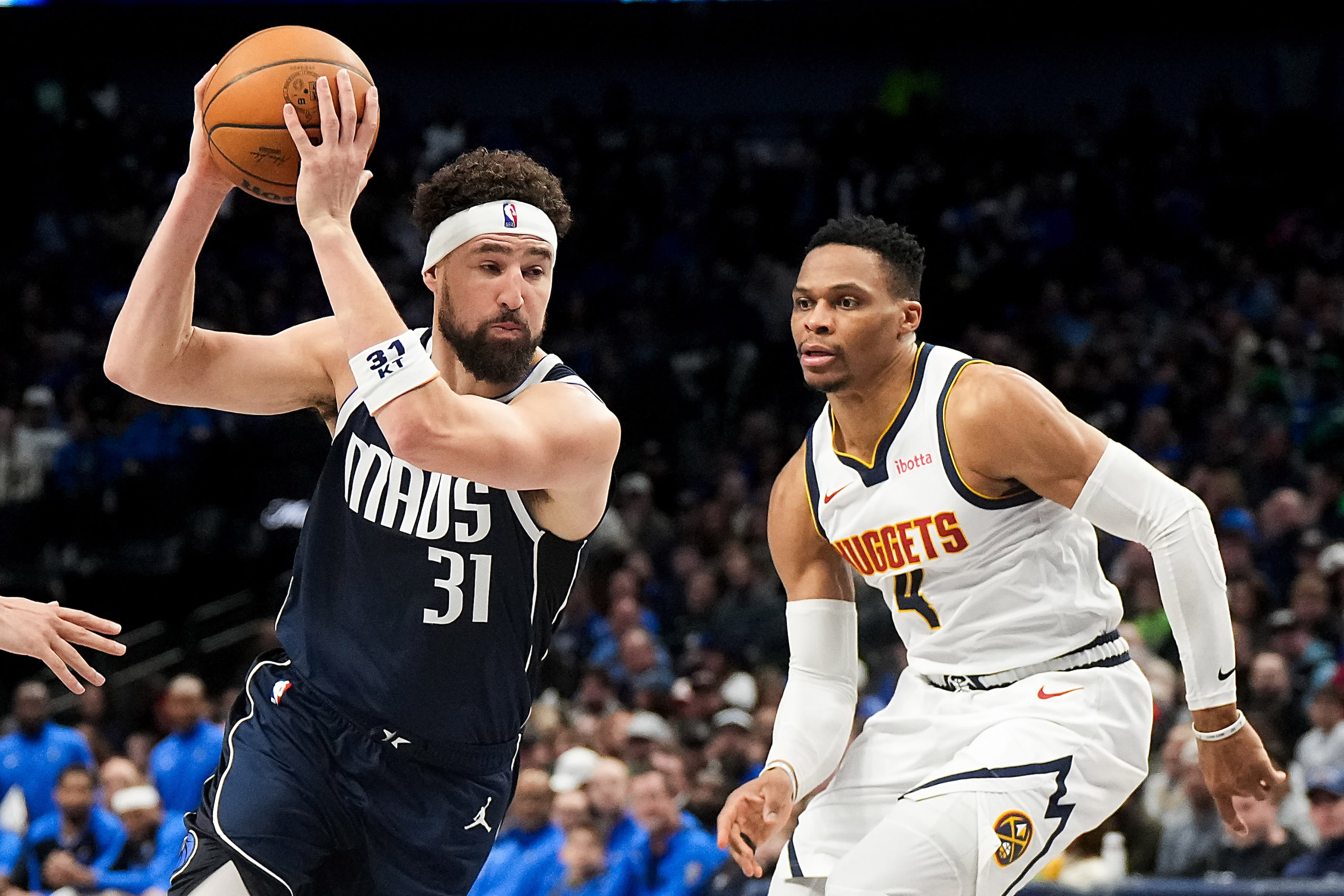 Dallas Mavericks guard Klay Thompson (31) drives past Denver Nuggets guard Russell Westbrook...