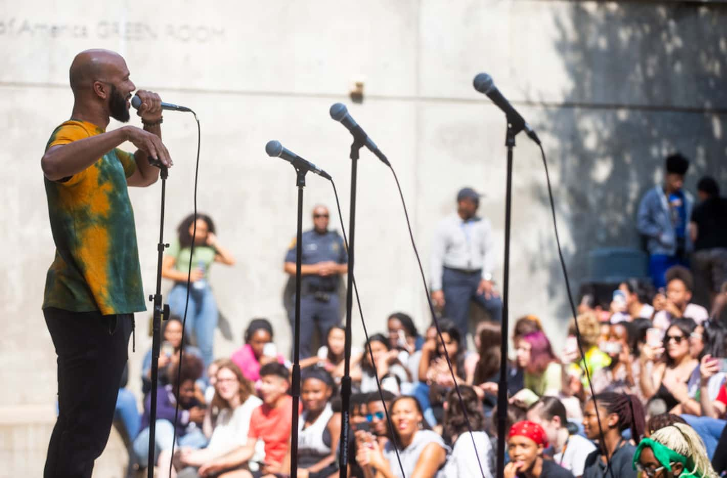 Rapper Common talks to students at Booker T. Washington High School for the Performing and...