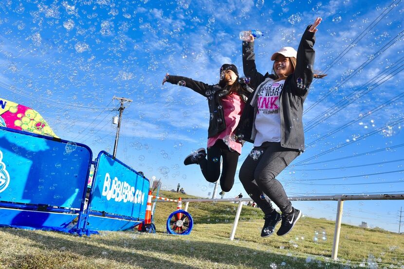 University of Arlington students Rachael Na, 23, left, and Cindy Nguyen, 24, get revved up...