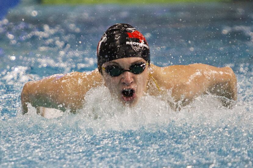 Nikita Naumov of Frisco Liberty competes in the first heat of the 100 yard butterfly during...