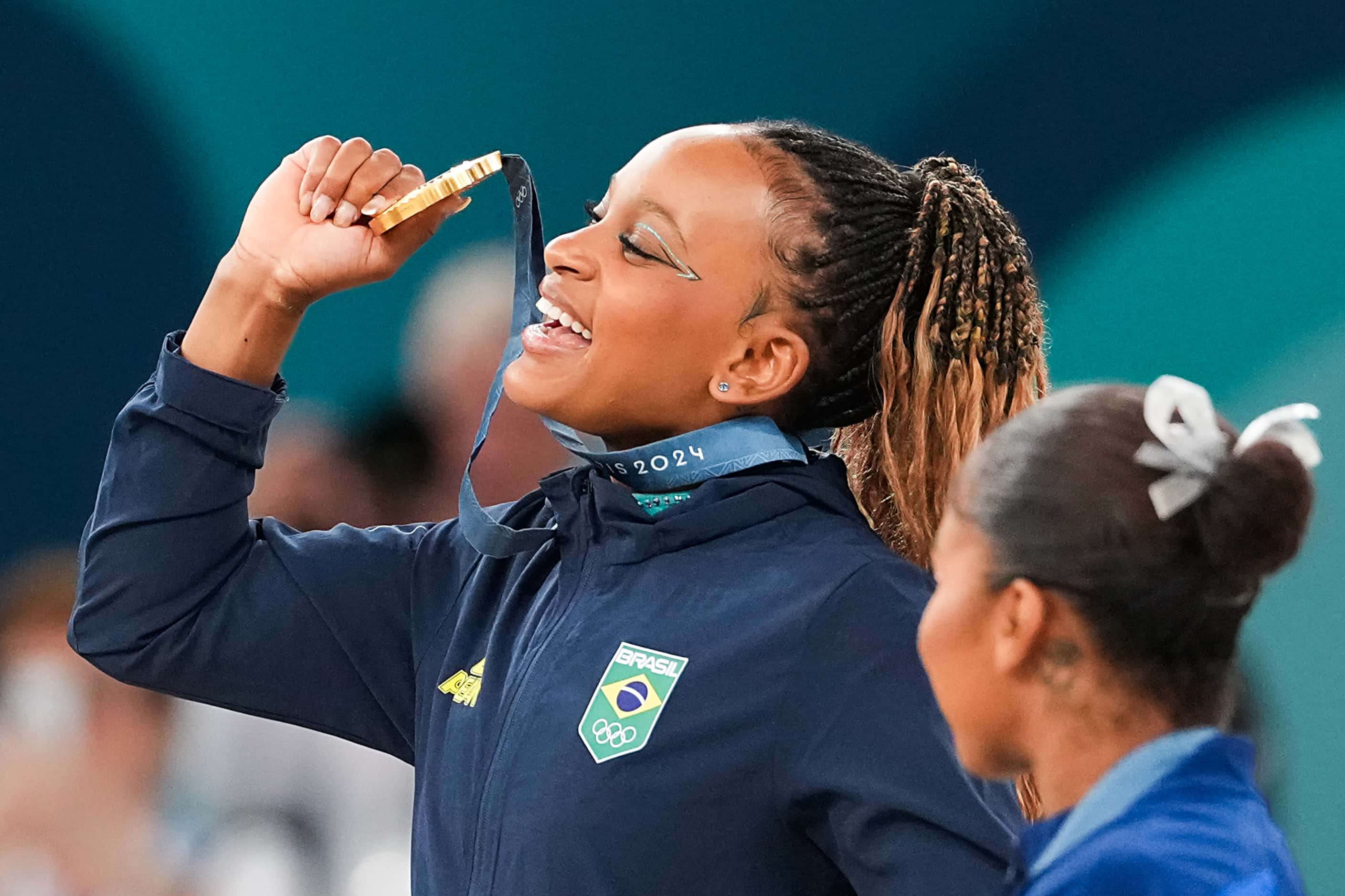 Gold medalist Rebeca Andrade of Brazil reacts after being awarded her medal after the...