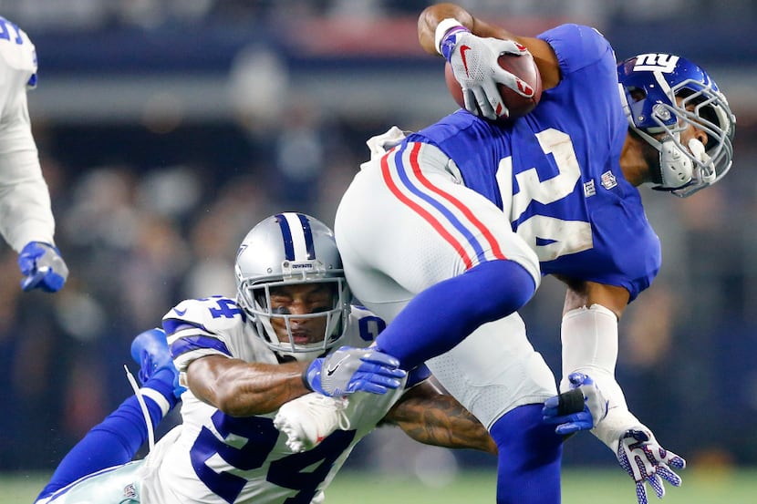 Dallas Cowboys defensive back Nolan Carroll (24) dives at New York Giants running back Shane...