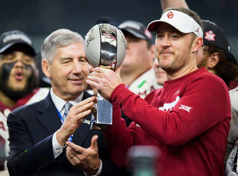FILE - Oklahoma Sooners head coach Lincoln Riley receives the Big 12 Championship trophy...