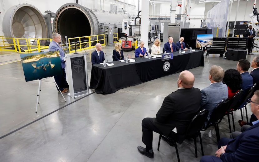 Texas Governor Greg Abbott (center) speaks alongside Bell Textron CEO Lisa Atherton (center,...