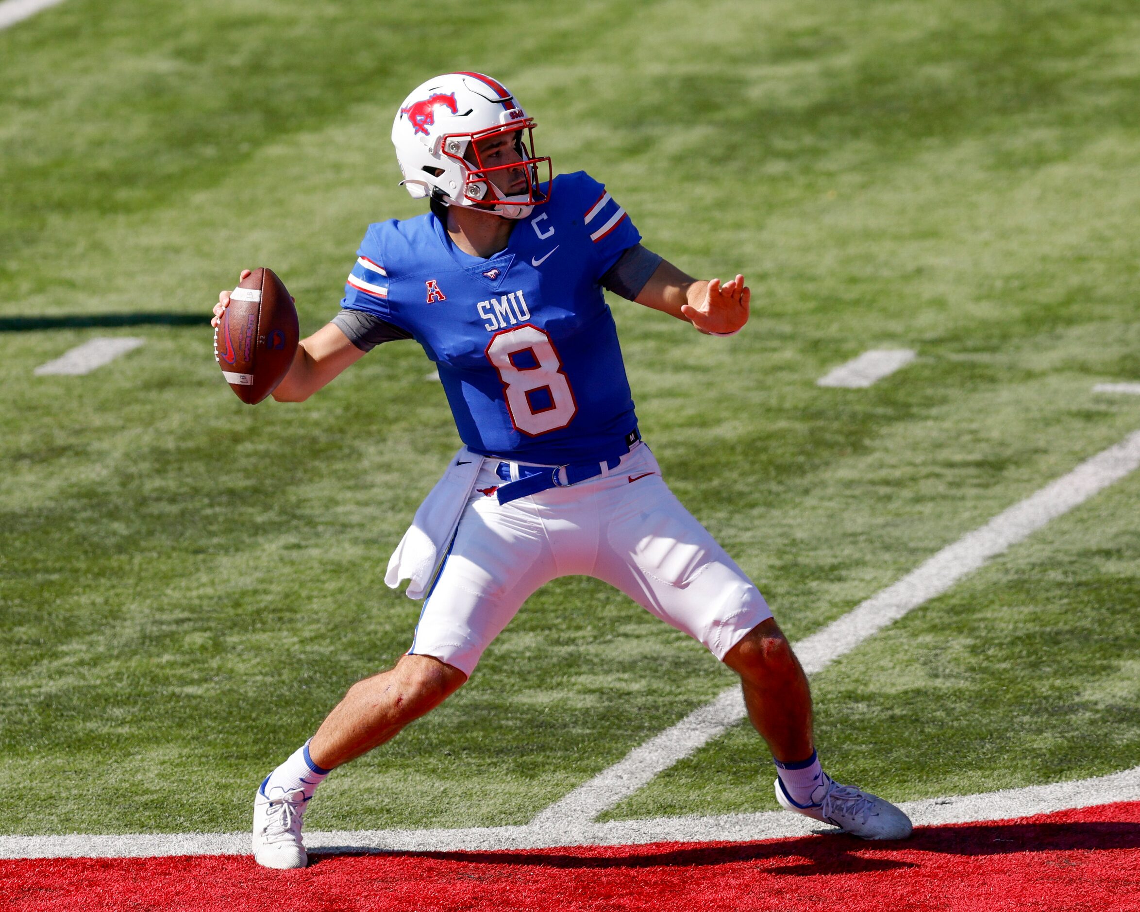 SMU quarterback Tanner Mordecai (8) throws a 43 yard pass to wide receiver Jordan Kerley (1)...