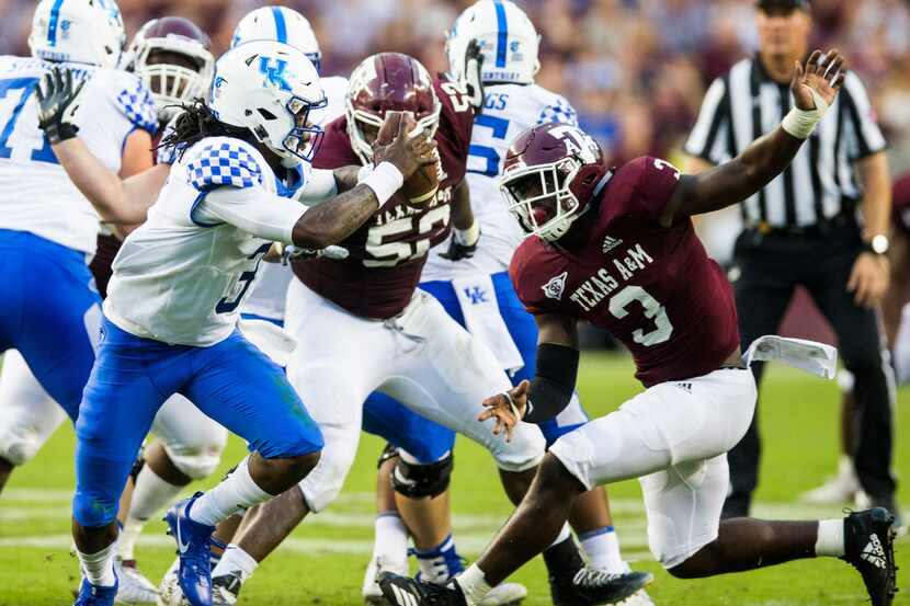 FILE - Texas A&M Aggies defensive lineman Tyree Johnson (3) and defensive lineman Justin...