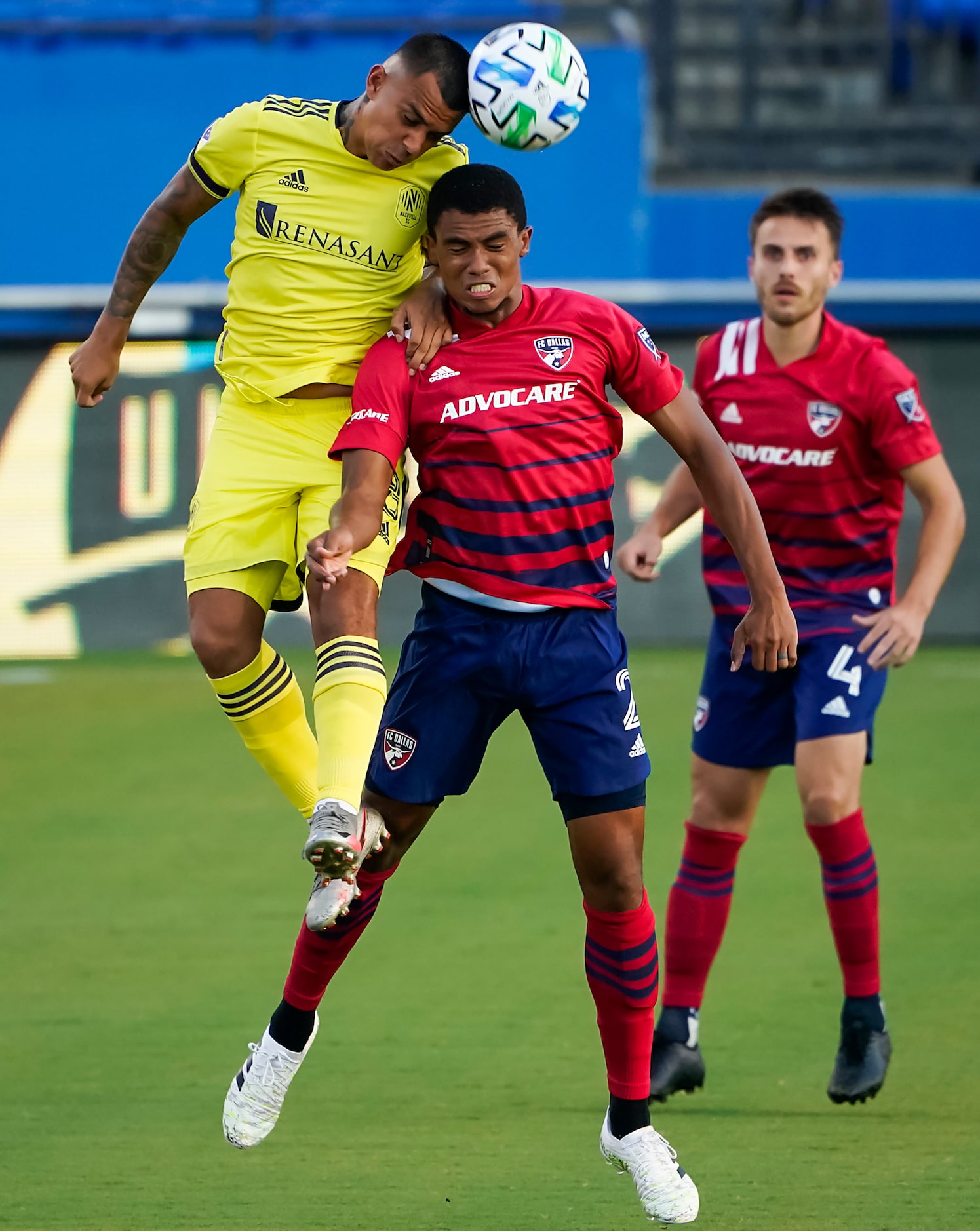 FC Dallas defender Reggie Cannon (2) fights for a header against Nashville SC midfielder...