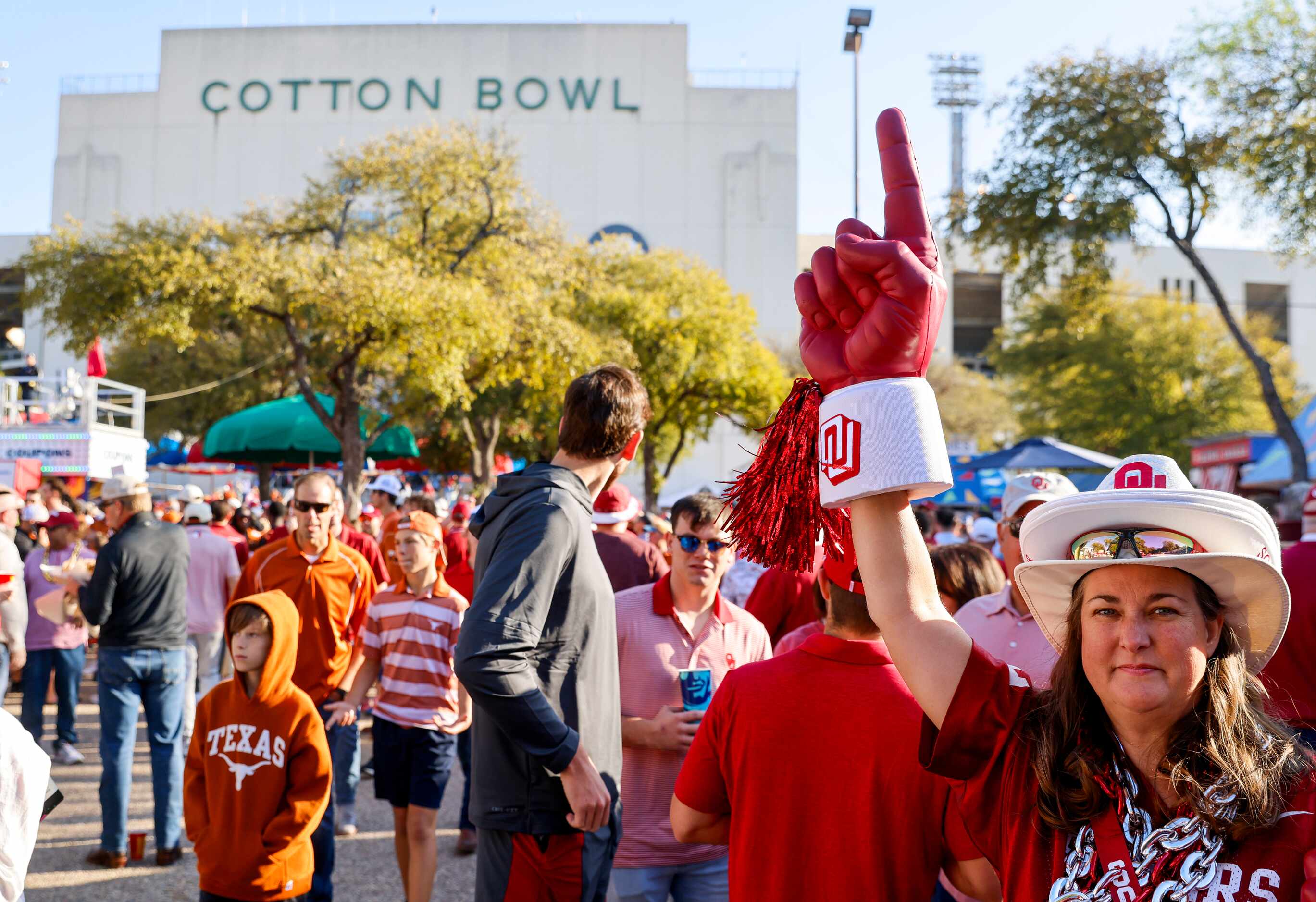 Jenny Field from Ft Worth waits outside the Cotton Bowl ahead of the Red River Showdown, on...