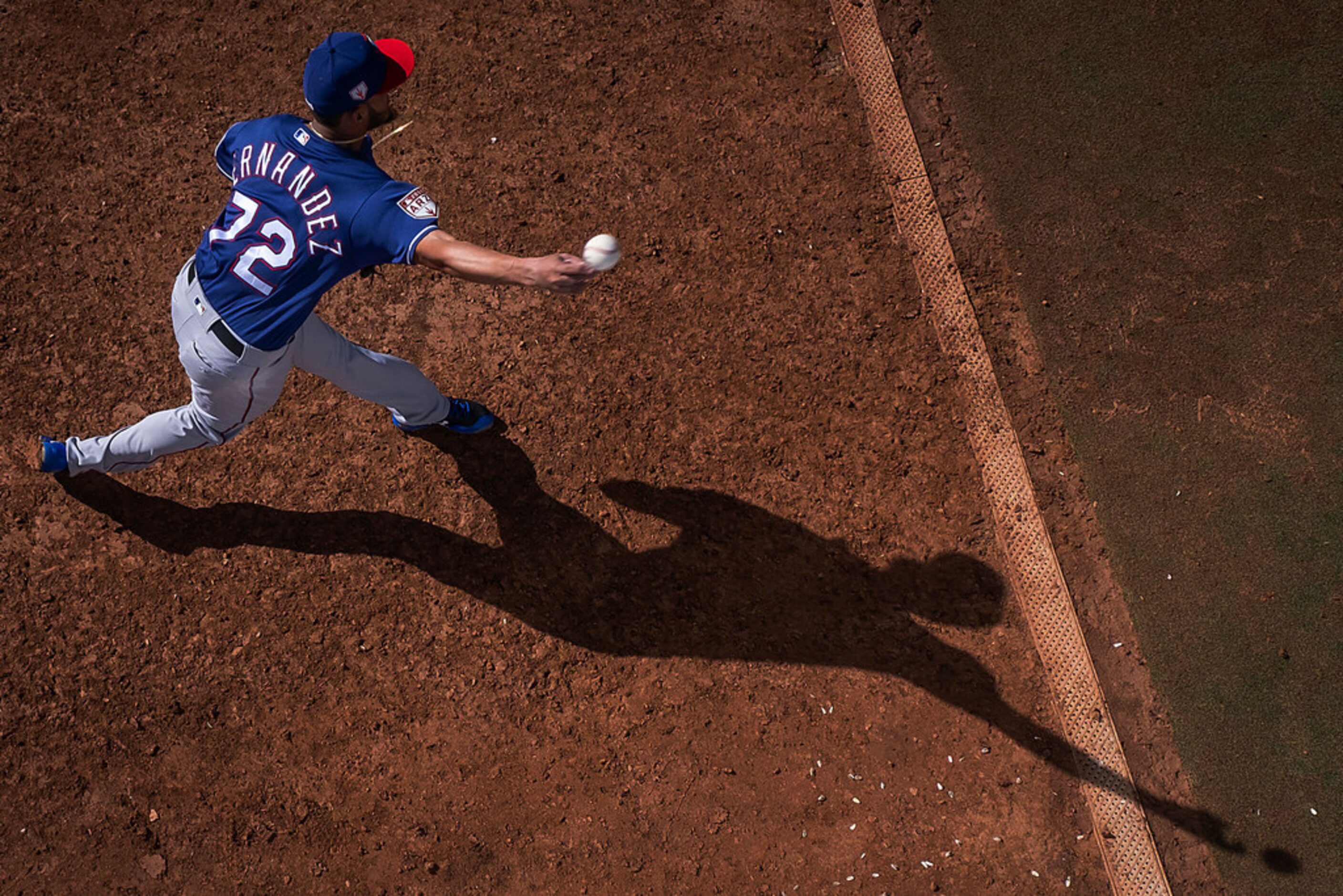 Texas Rangers pitcher Jonathan Hernâ¡ndez warms up in the bullpen during the fourth inning...