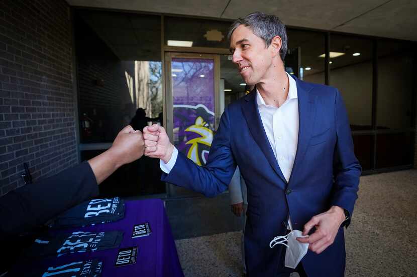 Democratic candidate for governor Beto O'Rourke first bumps a supporter after meeting with...