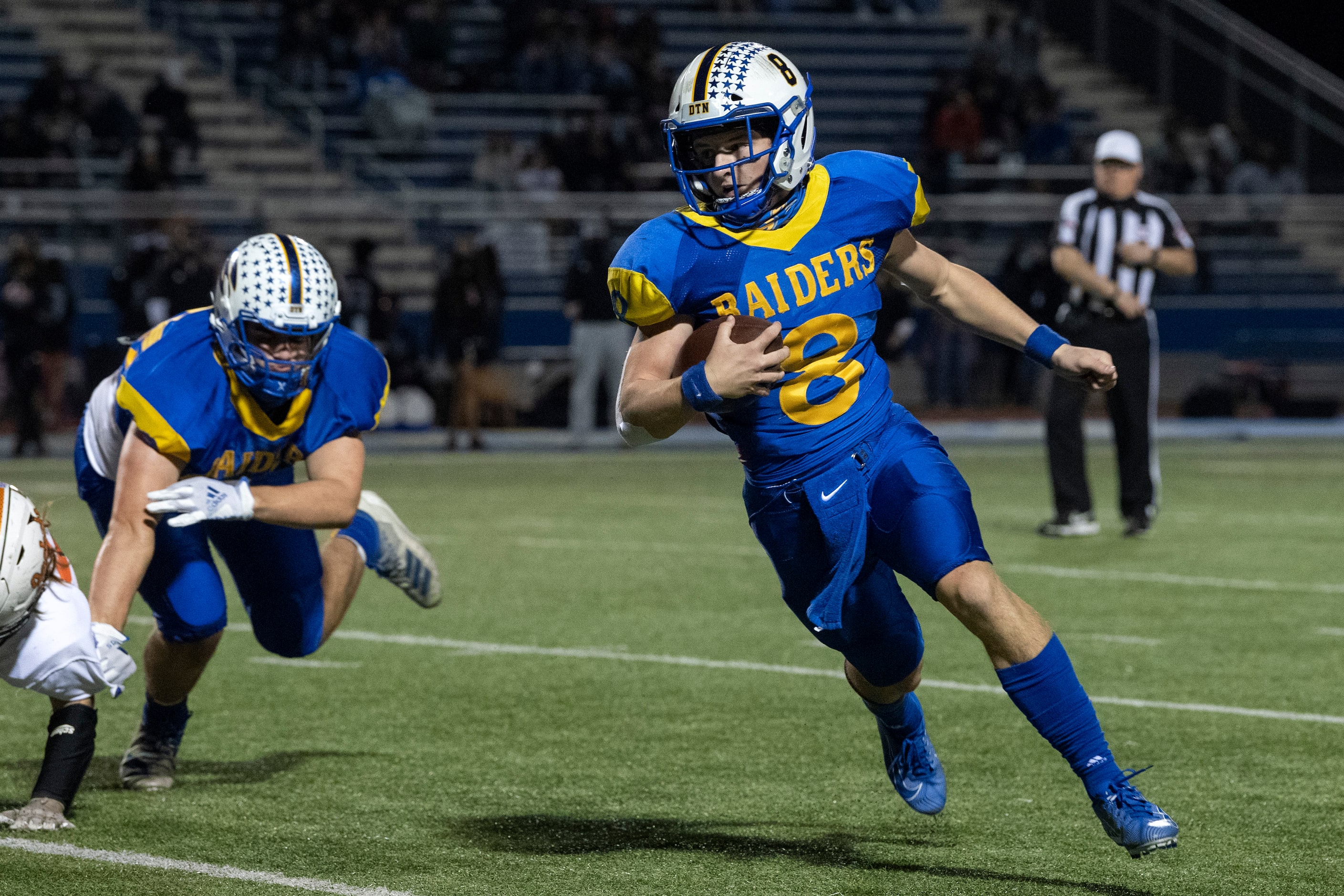 Sunnyvale senior quarterback Max McAda (8) turns the corner on a run in the first half of a...