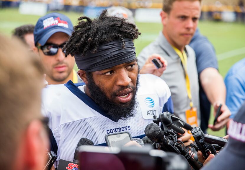 Dallas Cowboys running back Alfred Morris (23) speaks to reporters after a morning practice...