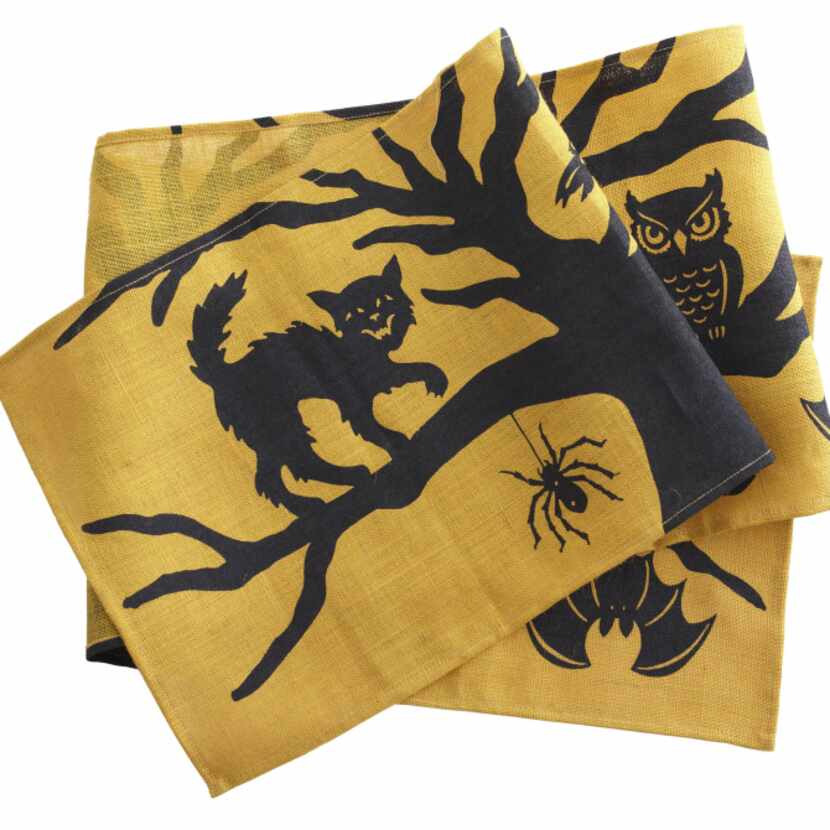 Enchanted forest Black cats, owls and bats on a hand-printed, jute table runner are ready to...