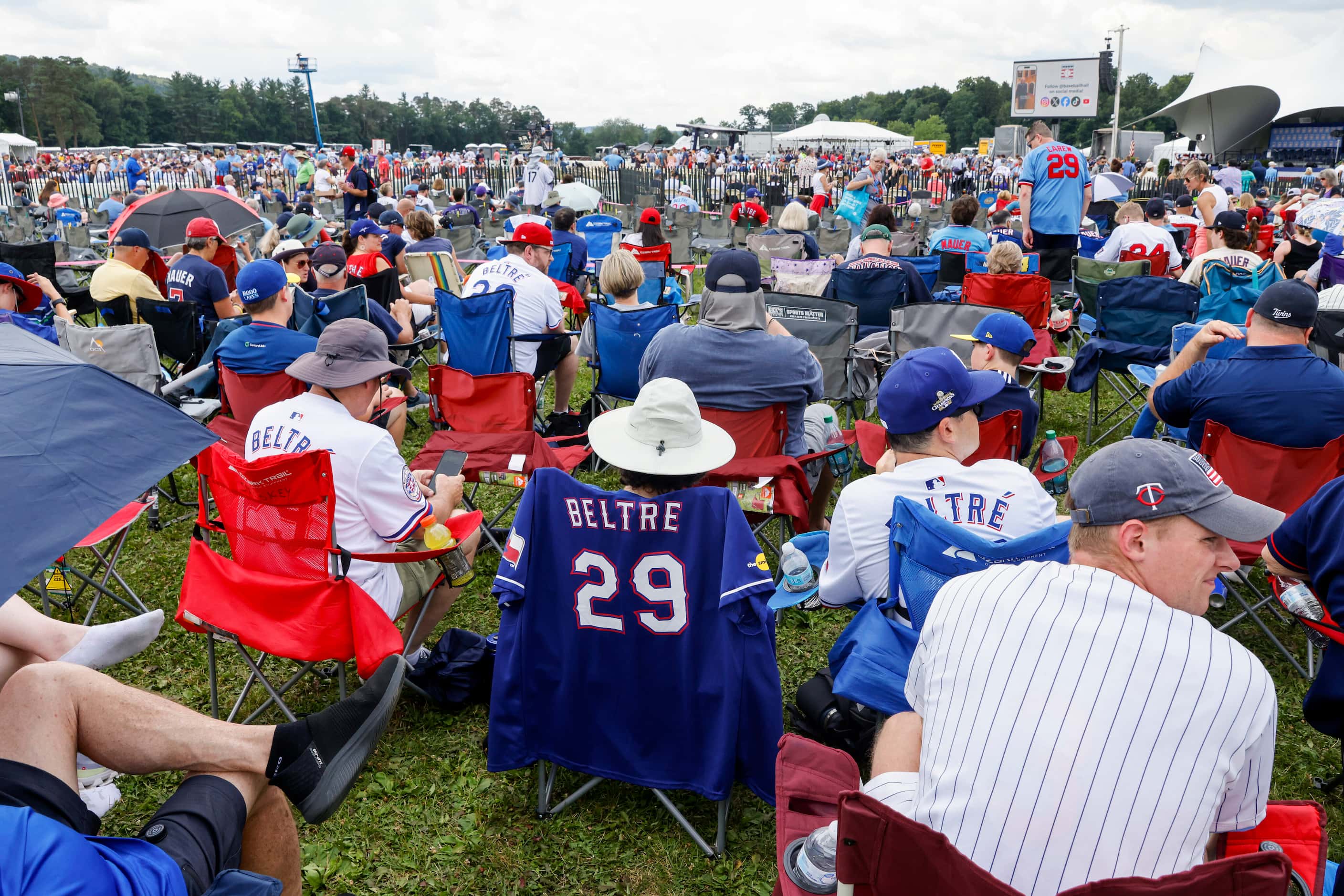 Former Texas Rangers third baseman Adrián Beltré fans sit in chairs before the National...