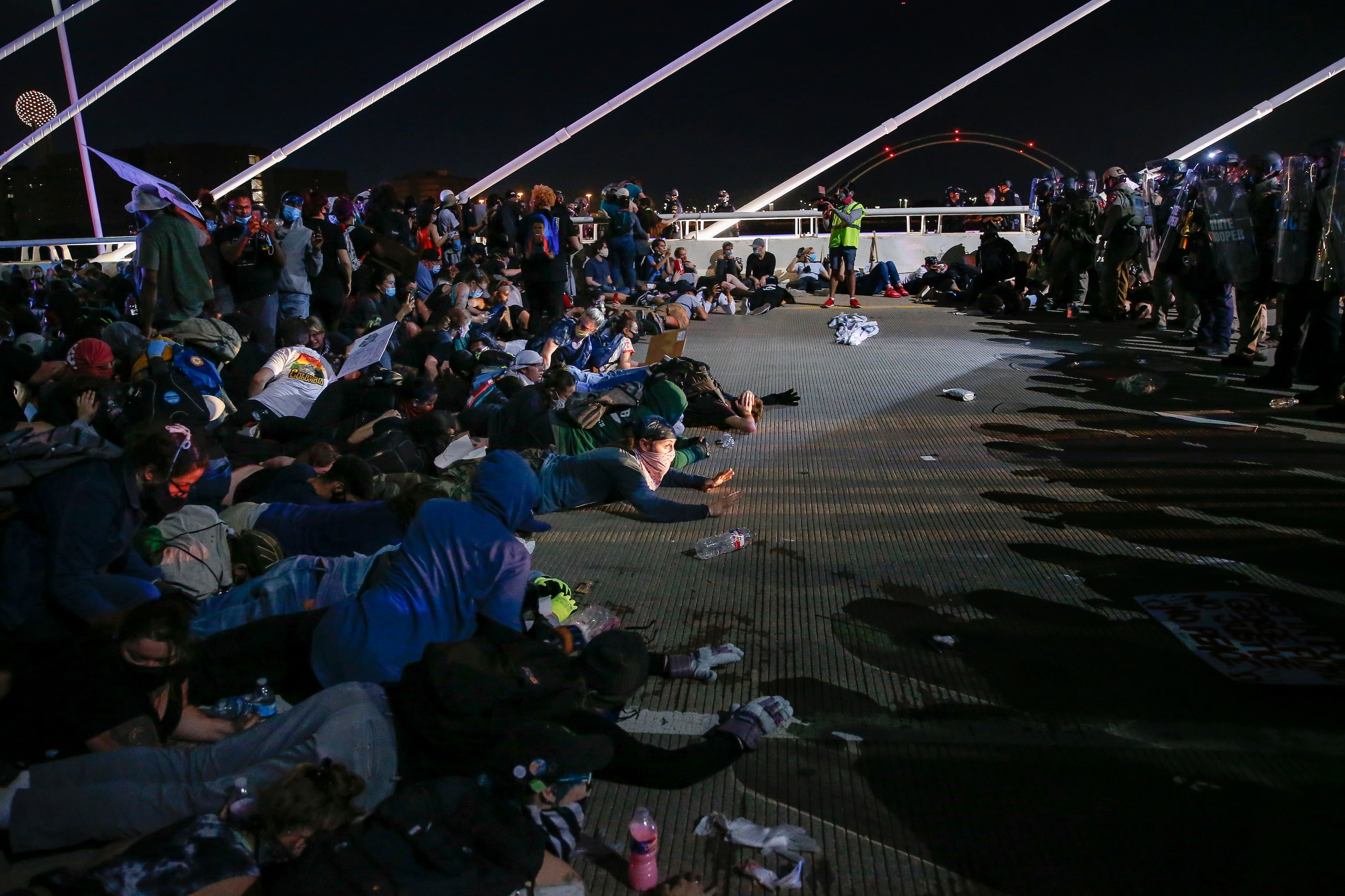 Police surround and detain hundreds of protesters who marched onto the Margaret Hunt Hill...