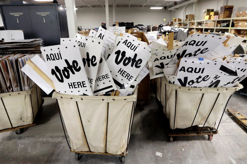 The  Bexar County election office in San Antonio had bins full of "Vote here" signs in...