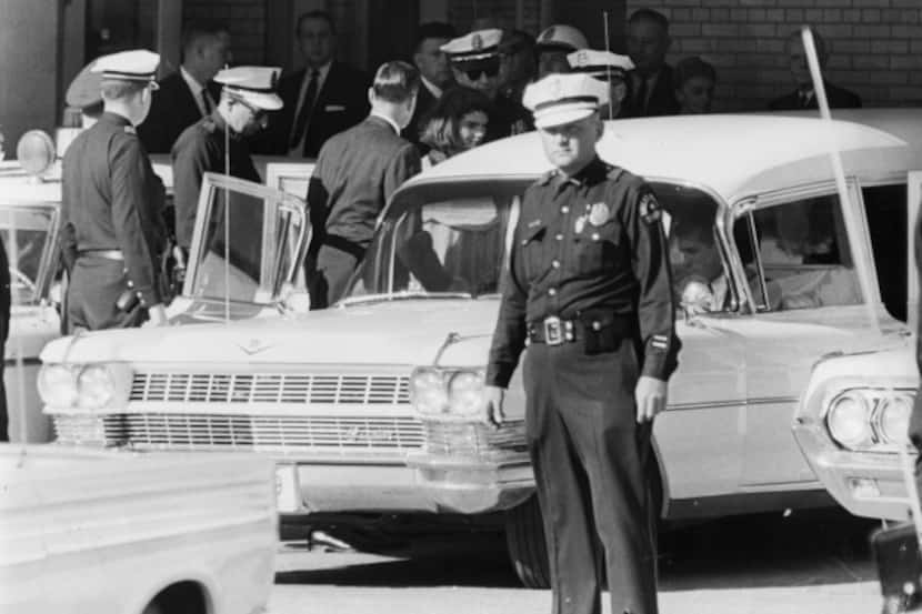 Outside Parkland Memorial Hospital, Jacqueline Kennedy entered the hearse bearing the body...