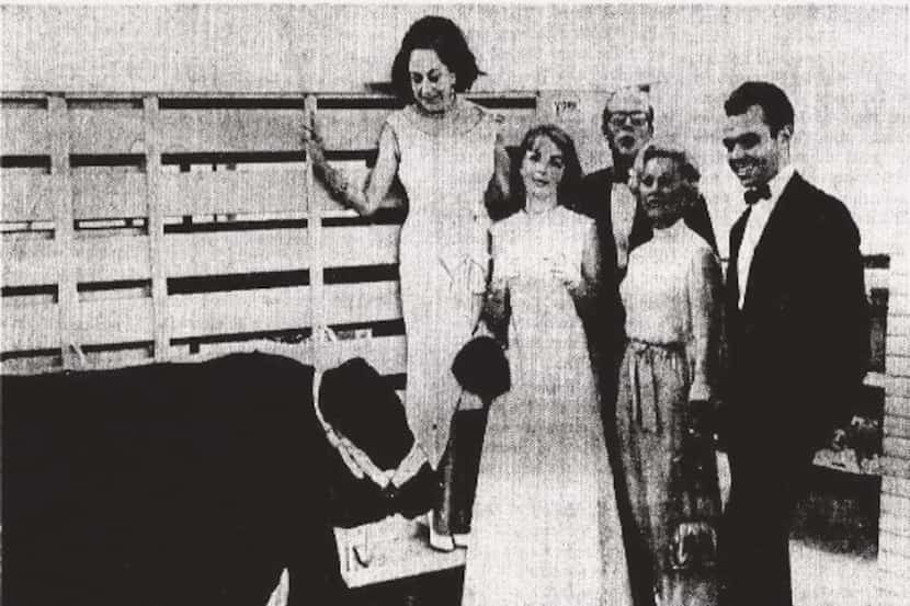 From June 7, 1966: The once-over, Black Angus and bidders. From left, Mrs. Jake Hamon, Miss...