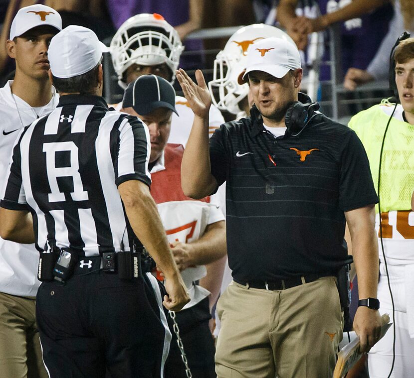 Texas head coach Tom Herman argues with referee Brad Van Vark during the second half of an...