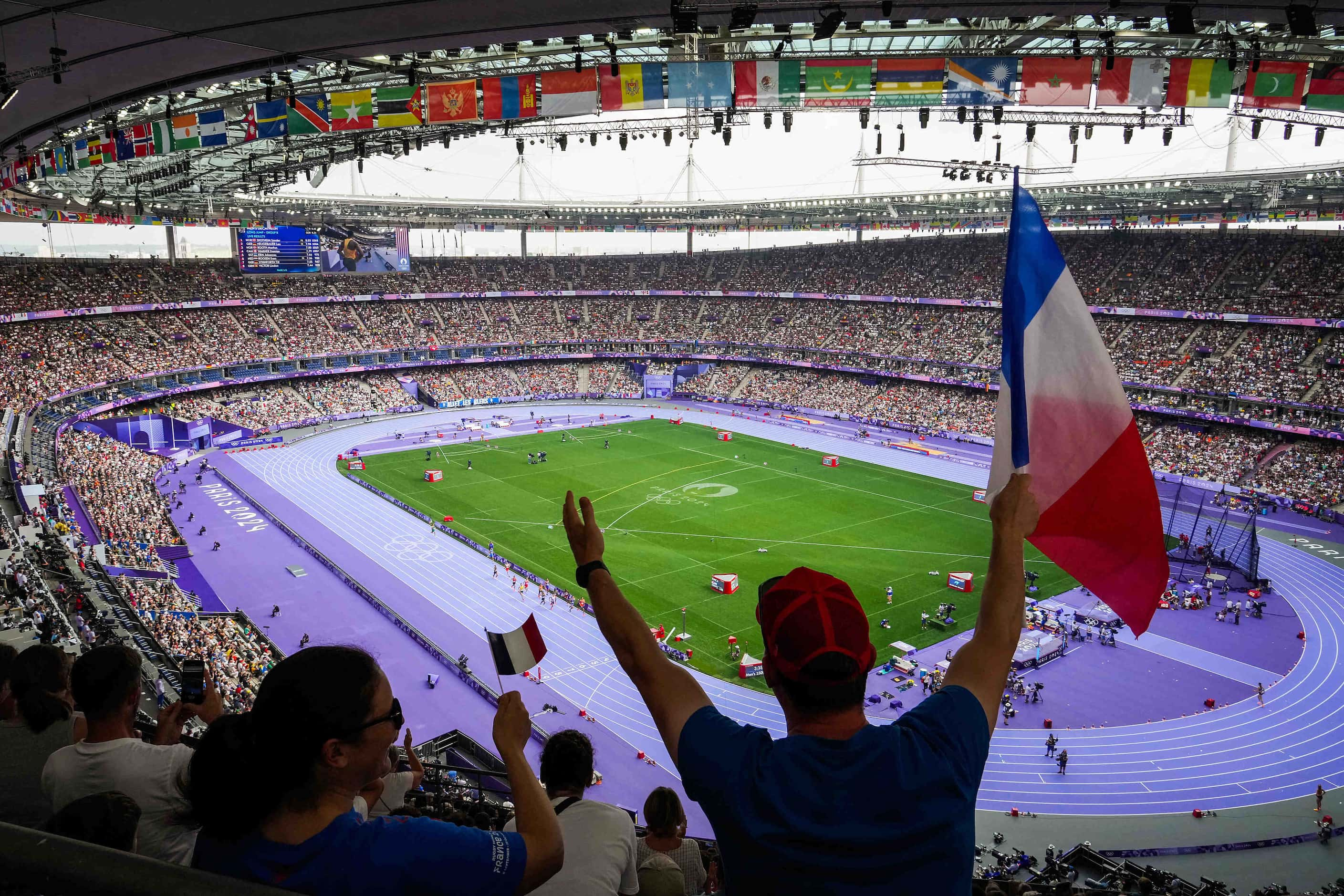 Fans cheer a heat of the men’s 1500-meters at the 2024 Summer Olympics on Friday, Aug. 2,...