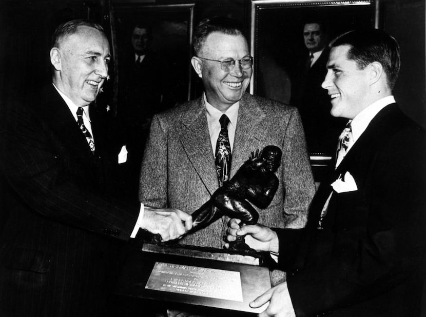 Doak Walker receives Heisman Trophy. 