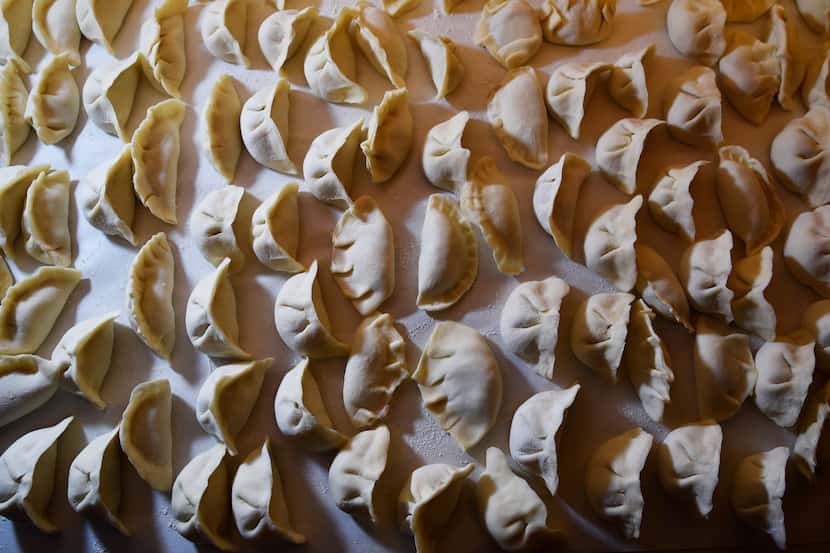 A bath of pork dumplings ready for boiling during a Chinese New Year party in Dallas on...