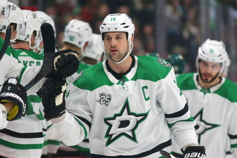 Dallas Stars left wing Jamie Benn (14) is congratulated after scoring against the Minnesota...