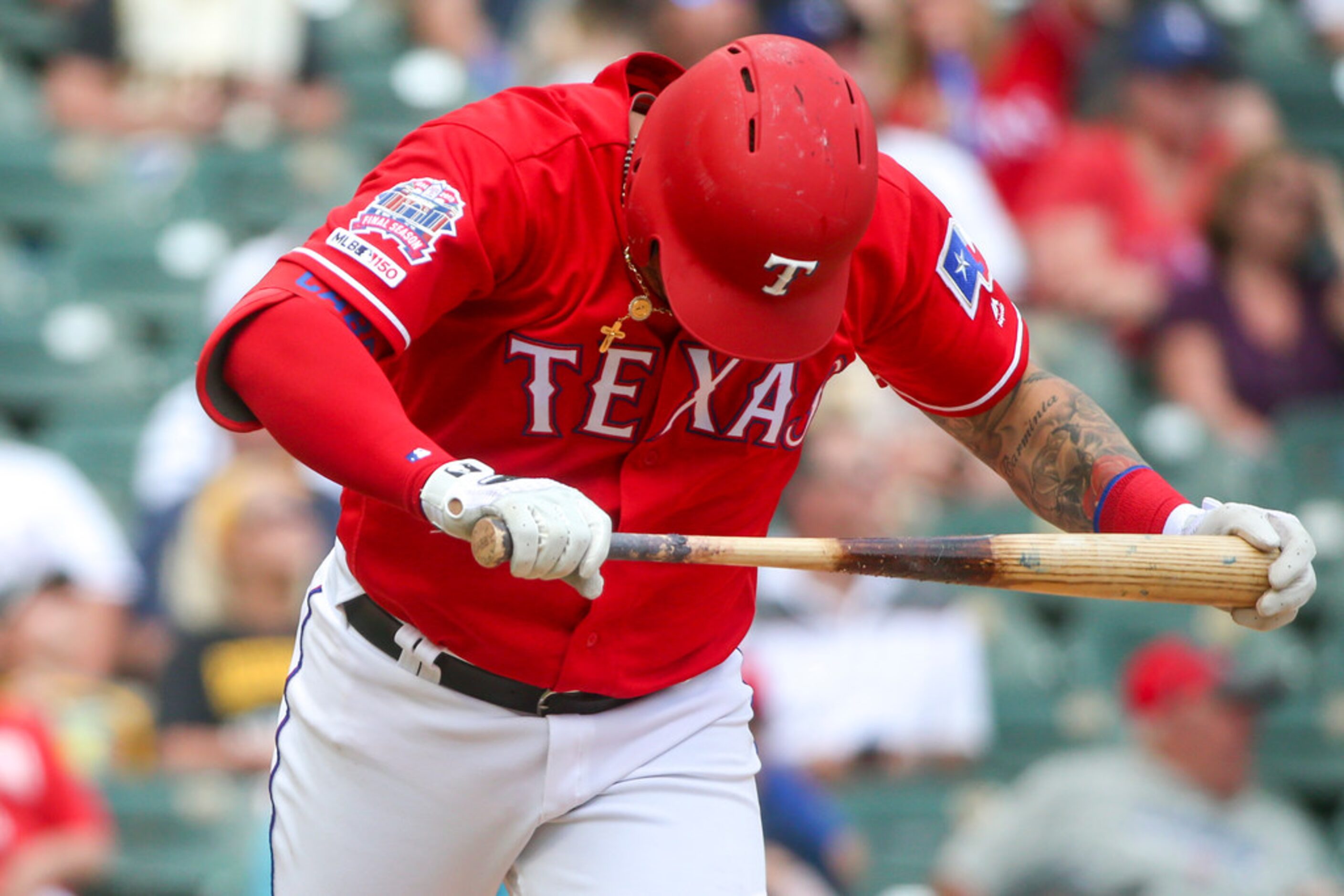 Texas Rangers third baseman Asdrubal Cabrera (14) reacts after his striking out during a...