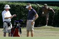 FILE - Caddie Mike Hicks, left, and Aaron Stewart, son of the late Payne Stewart, are seen...