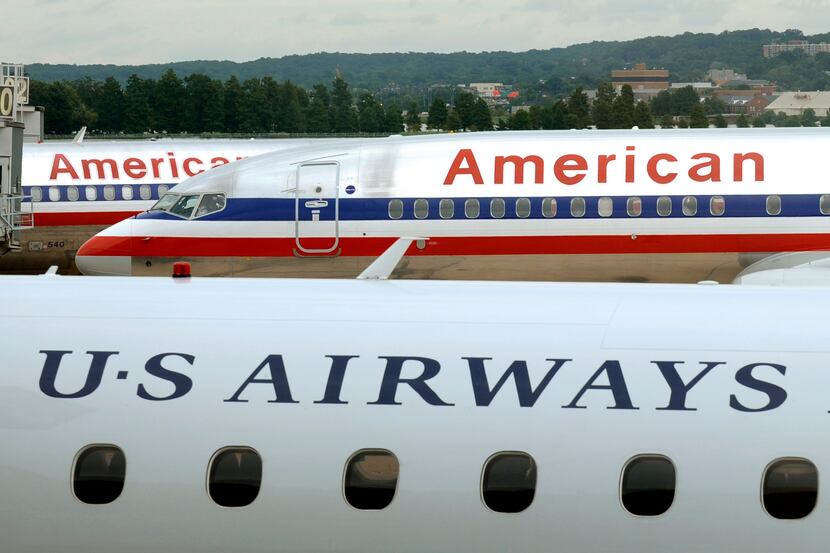 American Airlines planes and a US Airways plane at parked at Washington's Reagan National...