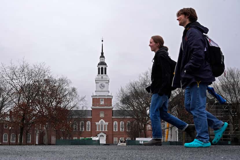 FILE - Students cross the campus of Dartmouth College, March 5, 2024, in Hanover, N.H. After...