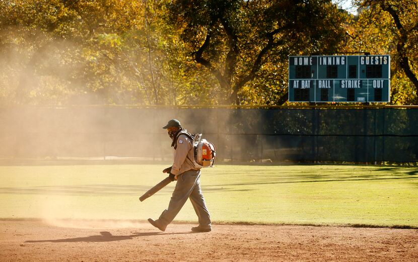 The weathered old-school scoreboard still stands in the outfield of Reverchon's century-old...