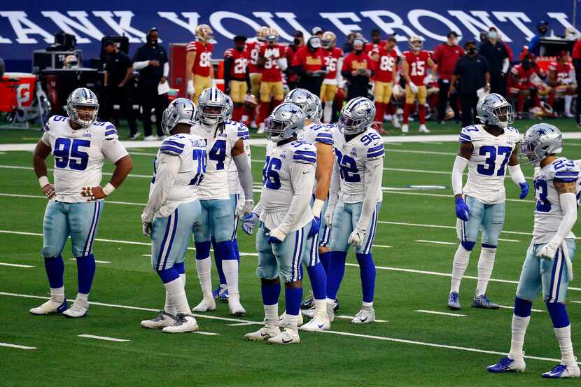 The Dallas Cowboys defense waits for play to resume during the fourth quarter against the...