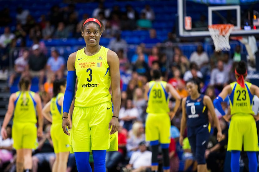 Dallas Wings guard Kaela Davis (3) smiles during a time out during the fourth quarter of a...