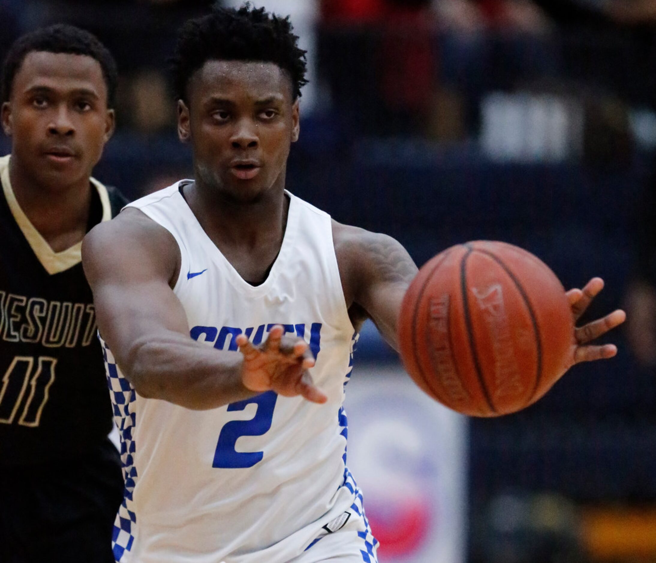 South Garland High School guard Chris Harris Jr. (2) passes the basketball during the first...