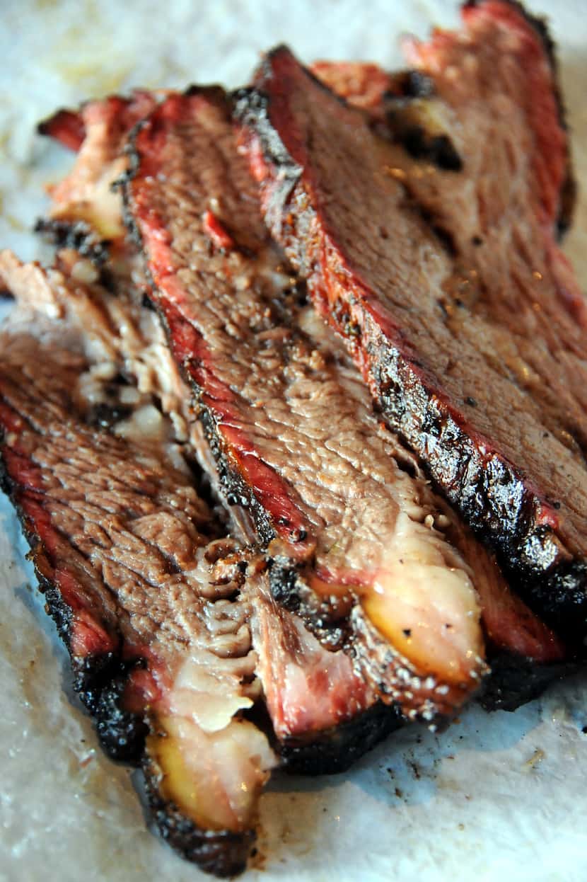 The brisket rubbed with salt and pepper (and "a few other seasonings," says owner Larry...