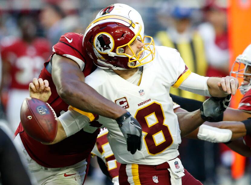 Arizona Cardinals defensive end Calais Campbell forces Washington Redskins quarterback Kirk...