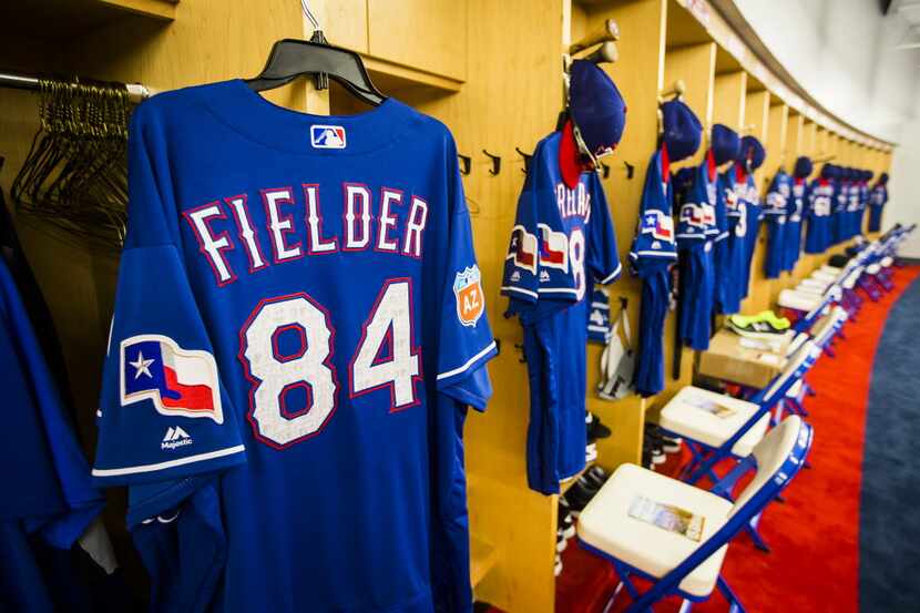 The jersey of first baseman/designated hitter Prince Fielder hangs at his locker in the...