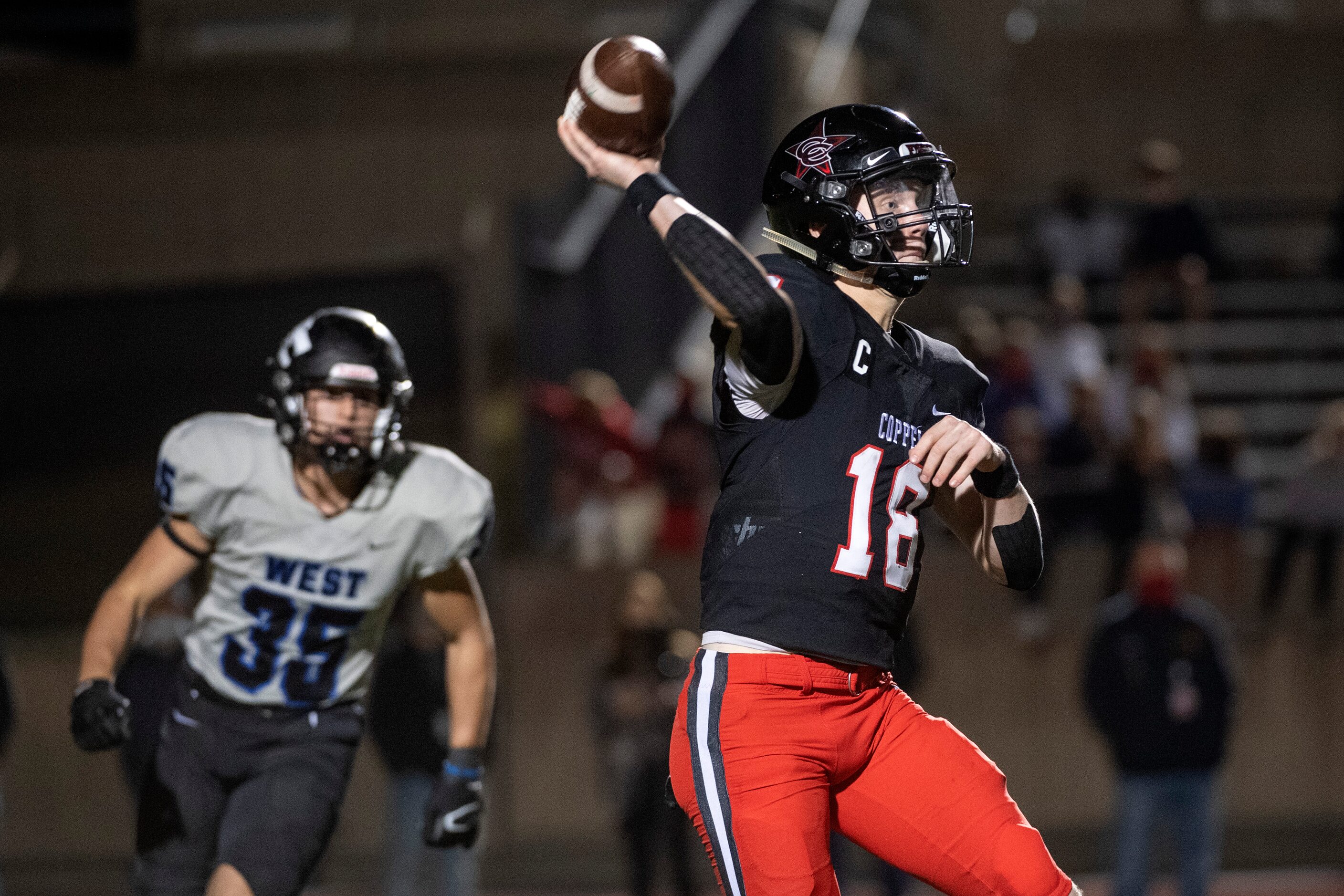 Coppell senior quarterback Ryan Walker (18) throws downfield and Plano West senior defensive...