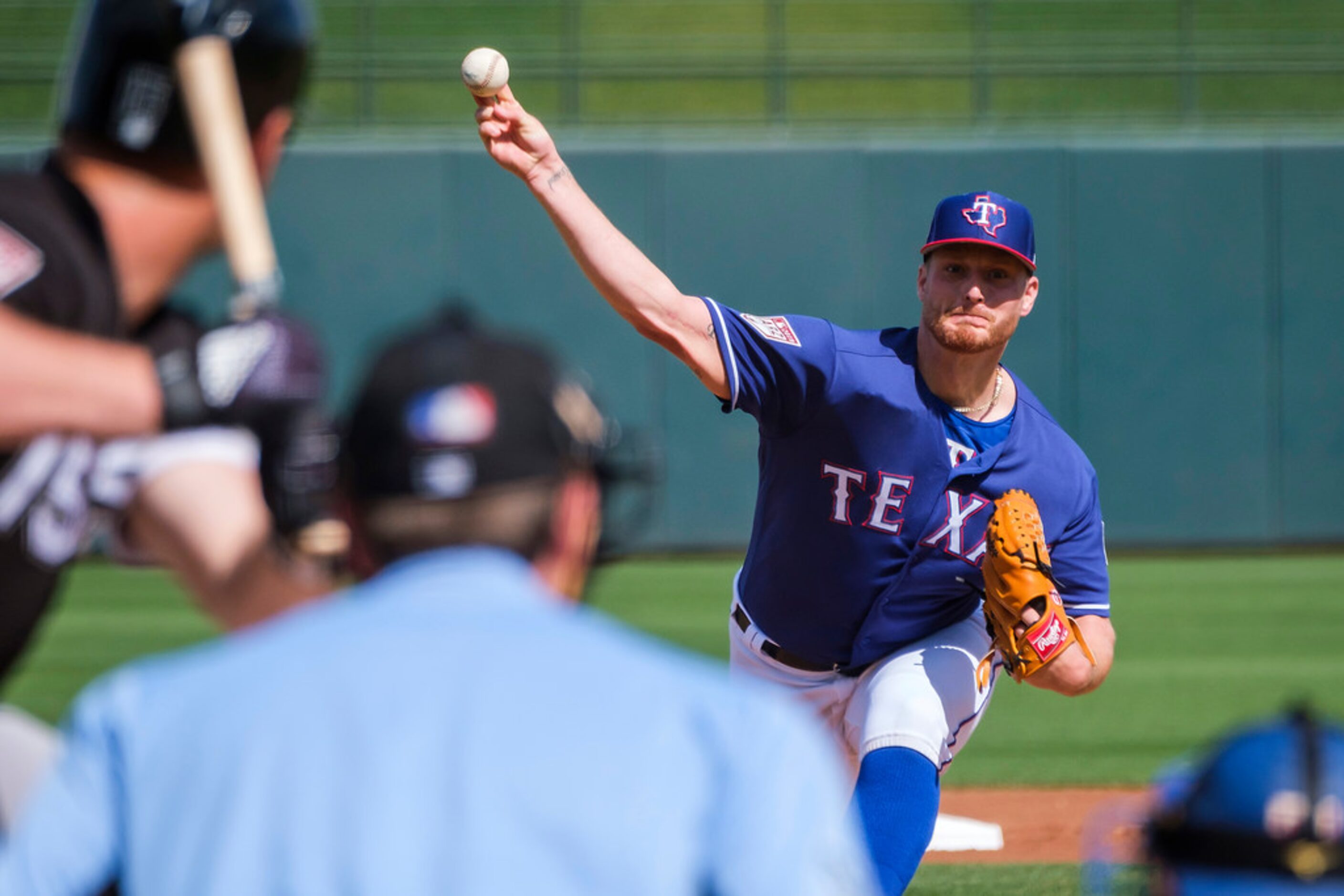 Texas Rangers pitcher Shelby Miller pitches during the first inning of a spring training...