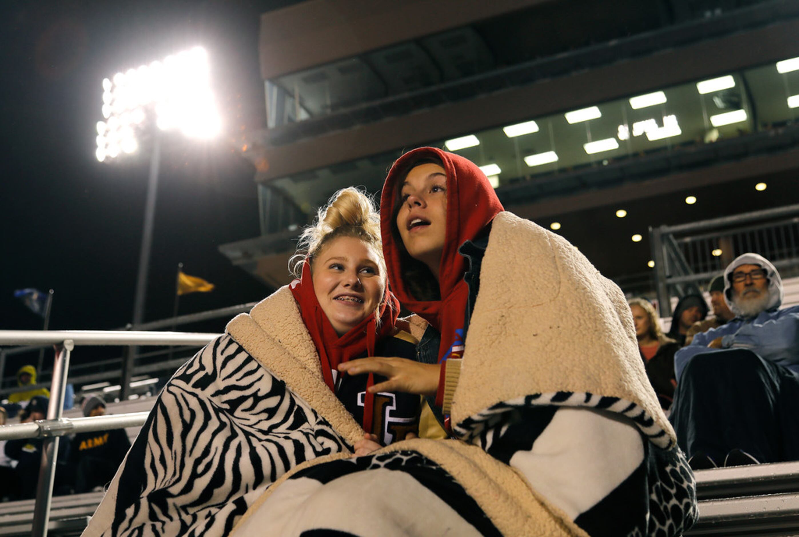 Little Elm High School students Kali Hufnagle (left), 16, and Felicity Mayfield, 16, try to...