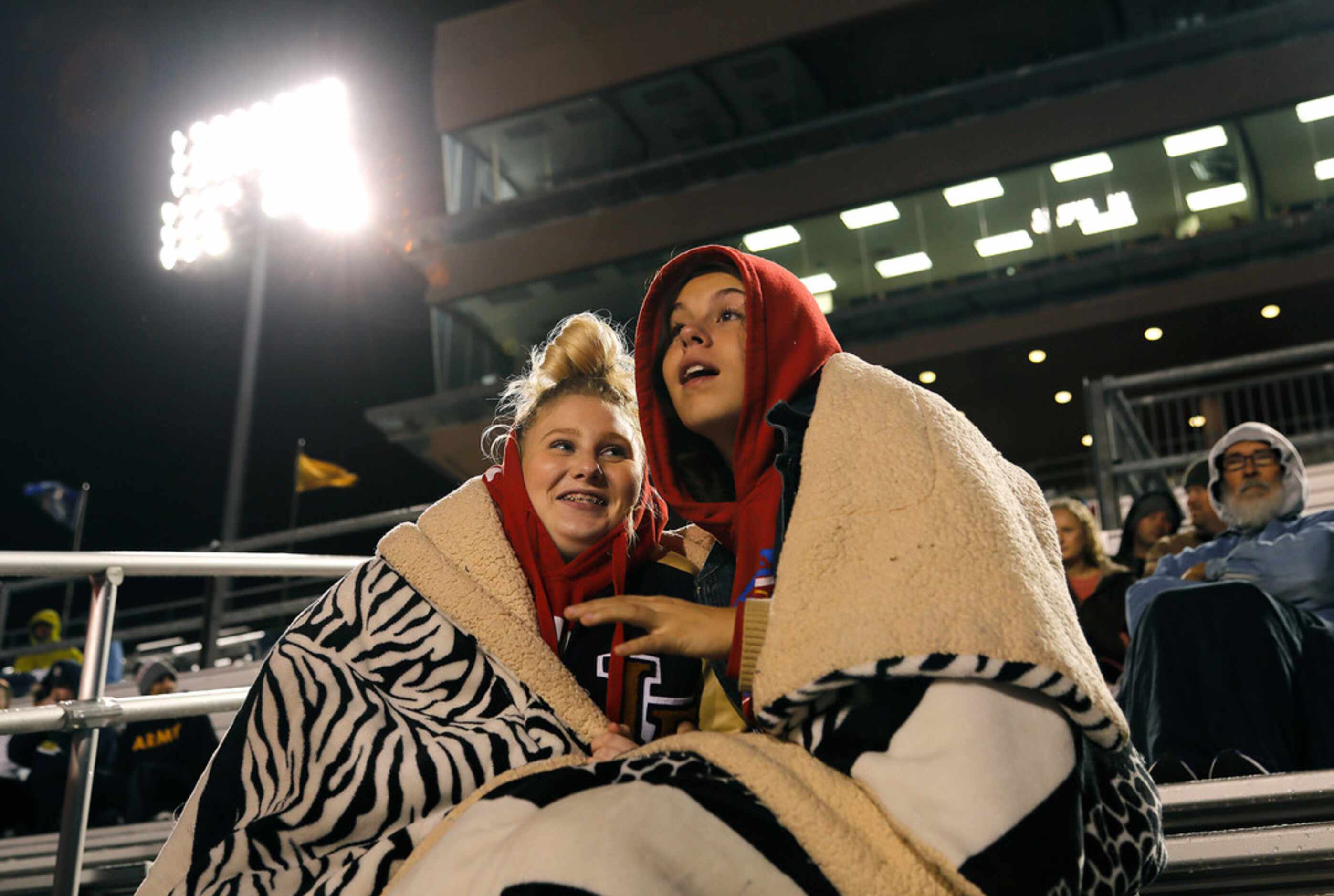 Little Elm High School students Kali Hufnagle (left), 16, and Felicity Mayfield, 16, try to...
