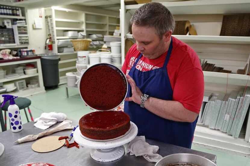 
David Morrow, manager of Candy Haven and Cakes in Denton, works on a specialty cake. Owner...
