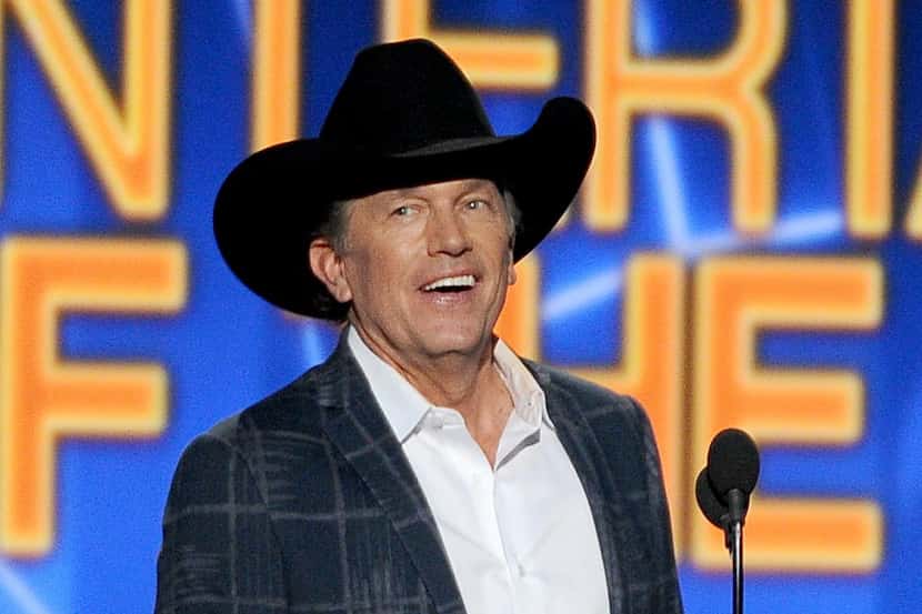 FILE - In this April 6, 2014 file photo, George Strait accepts the award for entertainer of...