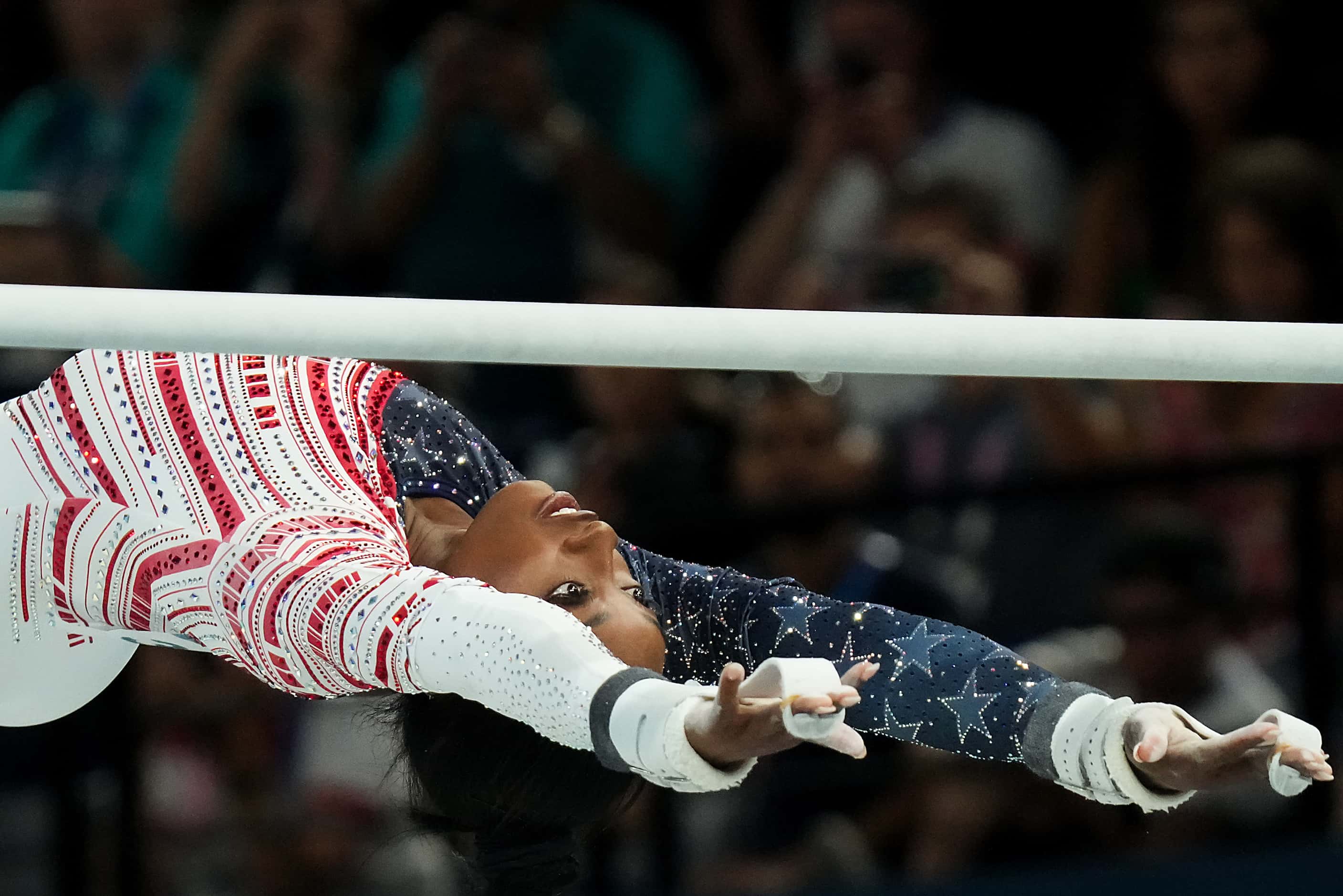 Simone Biles of the United States competes on the uneven bars during the women’s gymnastics...